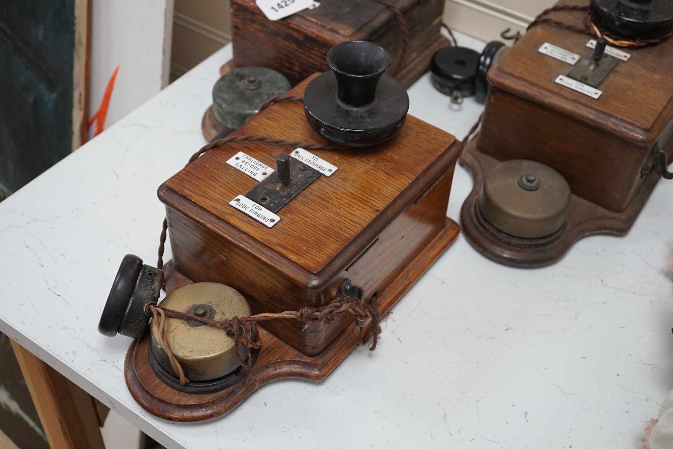 Three Ericsson oak cased railway signal box telephones, largest 30cms long